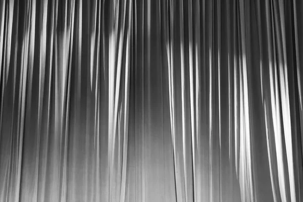 Black and white curtains and spotlight in the Theater between shows.