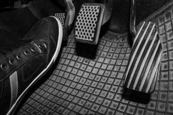 Foot while driving a clutch pedal. — Stock Photo, Image