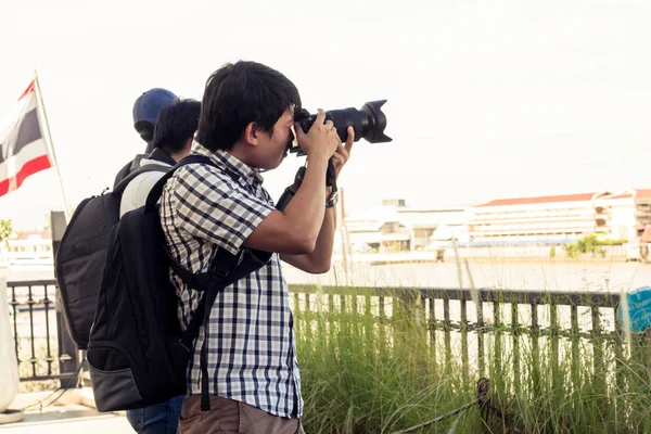 Group of men are standing photograph on the riverside in Thailan — Stock Photo, Image