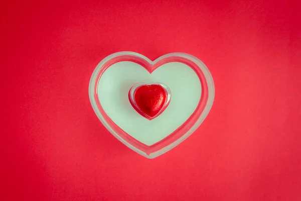 Red background with heart rests in the concept of Valentine's Da