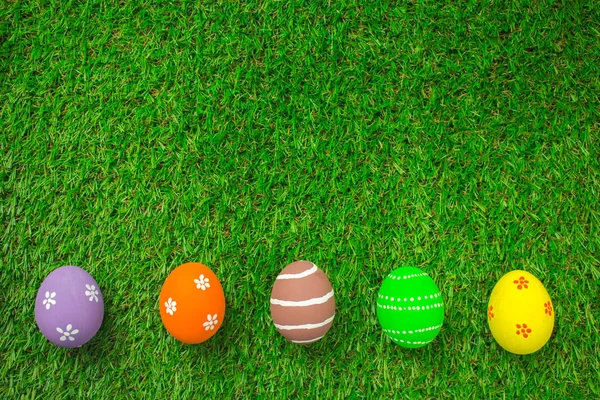 Easter eggs on the green grass.