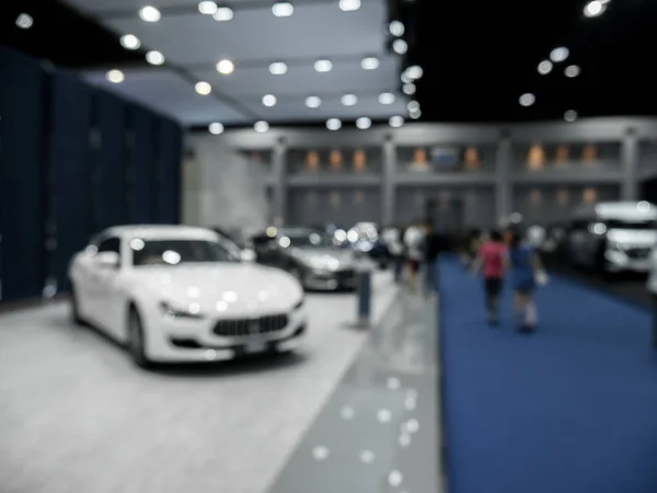 Background is out of focus and blurred at the auto show. — Stock Photo, Image