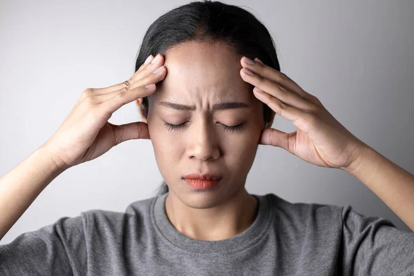 Young woman with of stress and headaches.