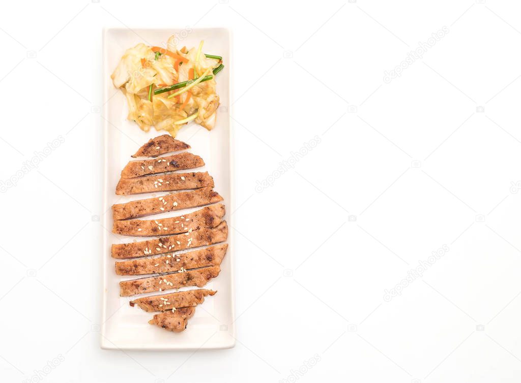 grilled sliced pork steak with vegetable isolated on white background