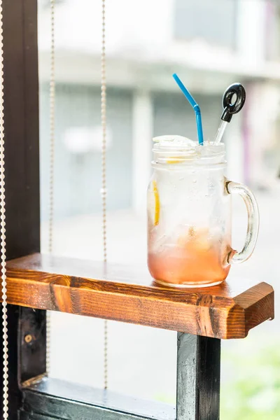 raspberry and lemon soda glass in cafe