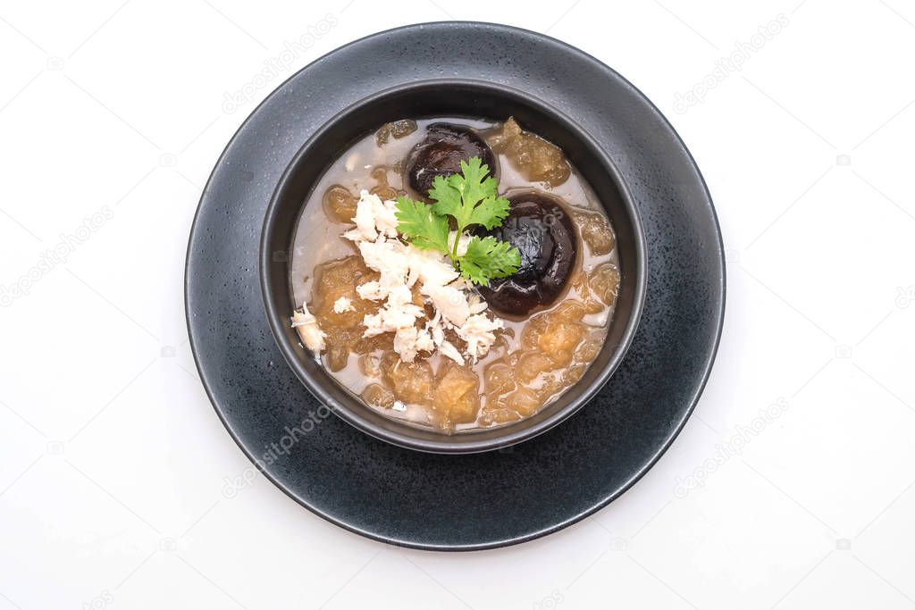Braised Fish Maw in Red Gravy Soup with Crab in bowl isolated on white background
