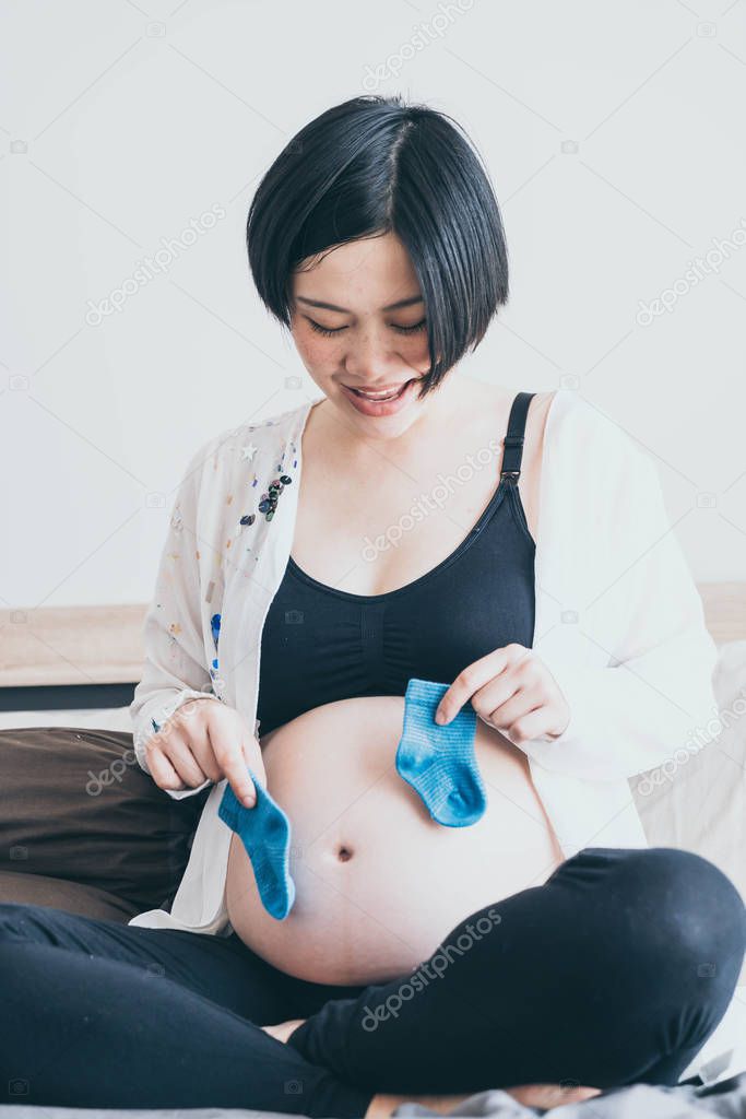 Asian pregnant with white baby