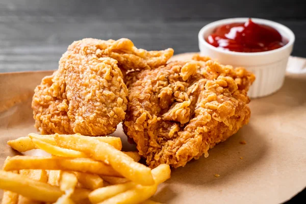 fried chicken with french fries and nuggets meal - junk food and unhealthy food