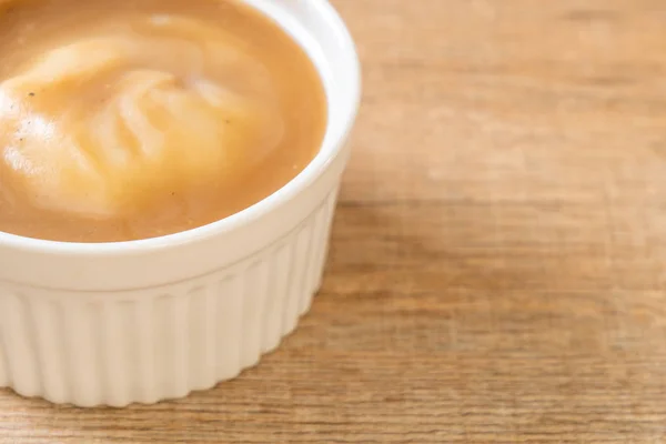 mash potatoes in gravy soup in cup