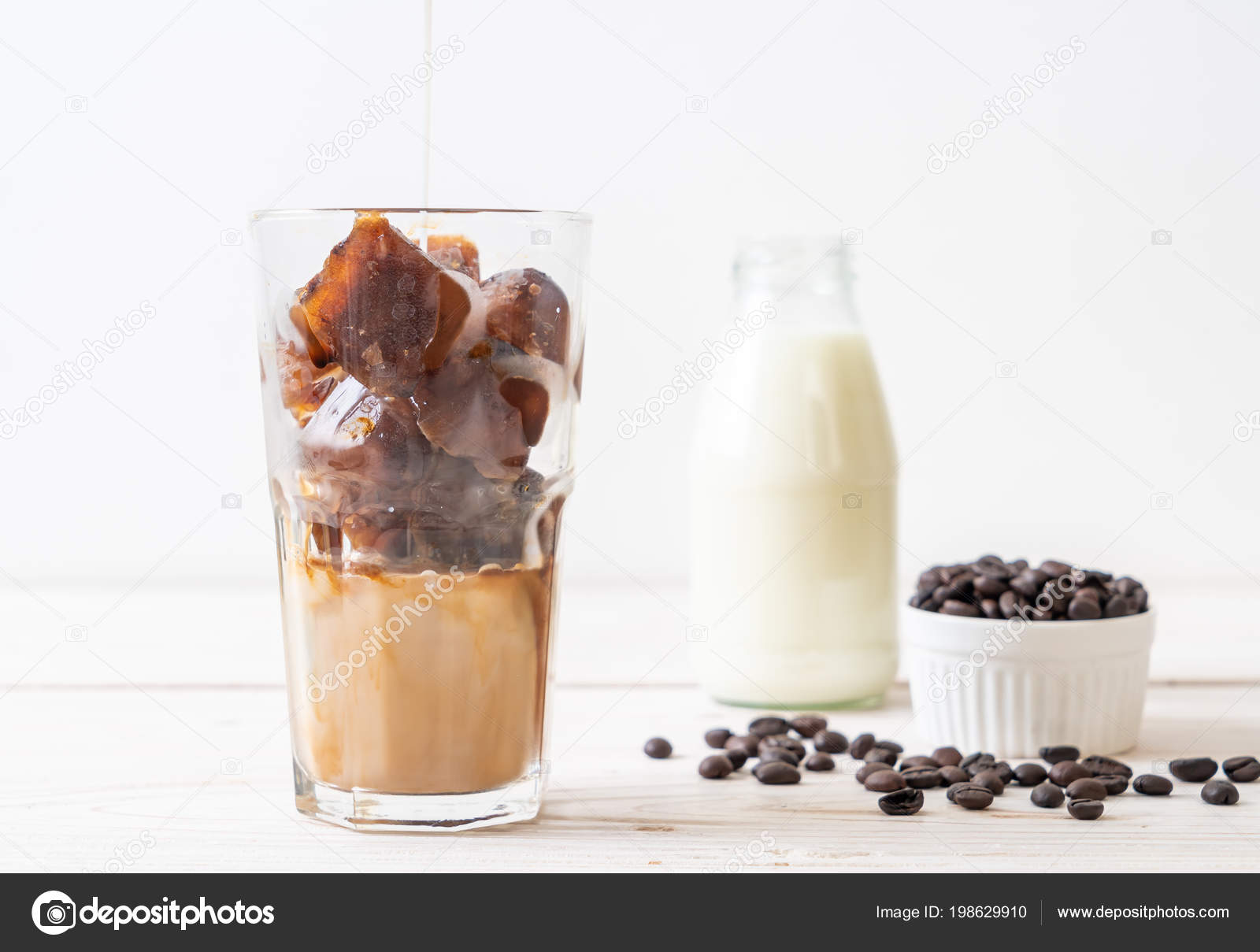 Coffee Ice Cubes Milk Wood Table Stock Photo Topntp 198629910 Coffee Ice Cubes Milk Wood Table Stock Photo