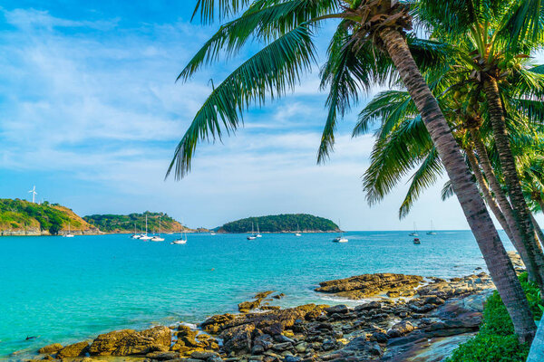 Beautiful tropical beach and sea with coconut palm tree in paradise island - Holiday Vacation concept