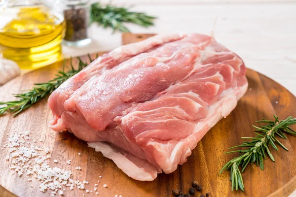 fresh pork raw fillet on wooden board