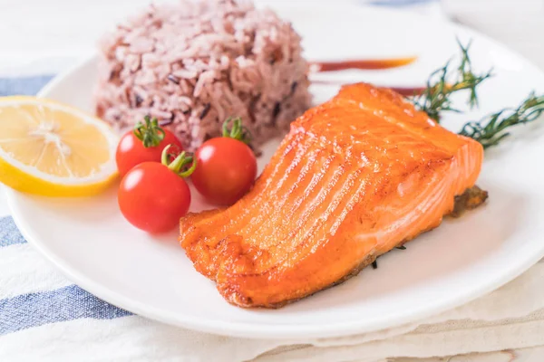 Salmon Steak with Berry Rice on plate