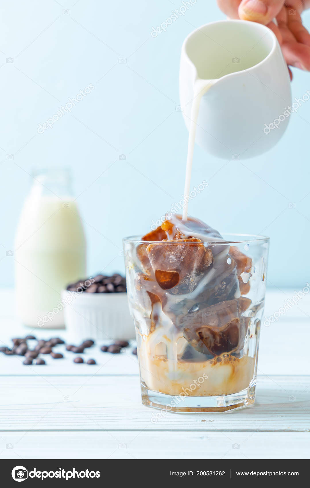Coffee Ice Cubes Milk Wood Table Stock Photo Topntp 200581262 Coffee Ice Cubes Milk Wood Table Stock Photo