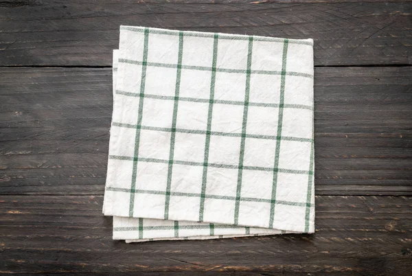 kitchen cloth (napkin) on wood background - vintage effect filter