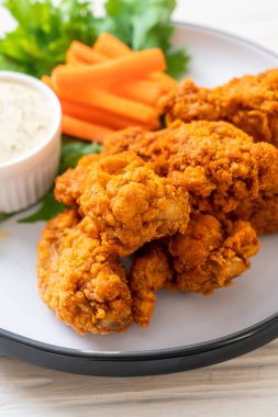fried spicy chicken wings with vegetable clipart