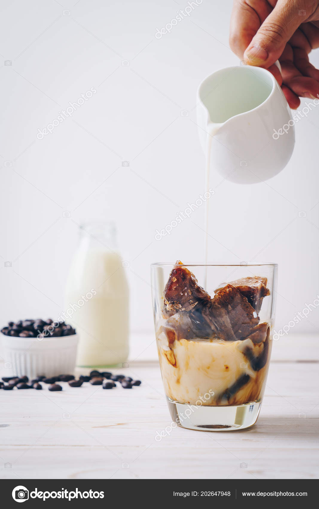 Coffee Ice Cubes Milk Wood Table Stock Photo Topntp 202647948 Coffee Ice Cubes Milk Wood Table Stock Image