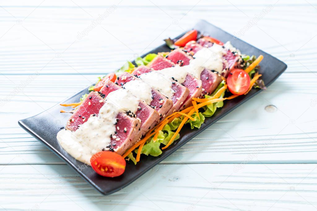 fresh tuna raw with vegetable salad and sauce - healthy food