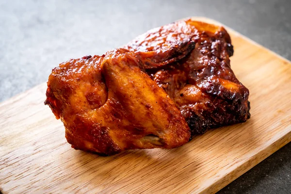 grilled and barbecue chicken on table