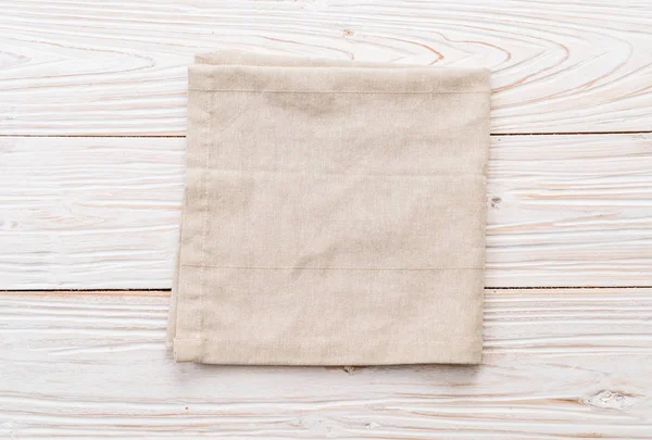 kitchen cloth (napkin) on wood background