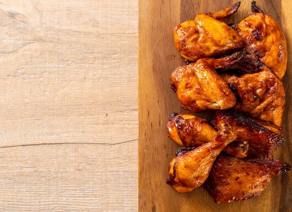 grilled and barbecue chicken on table