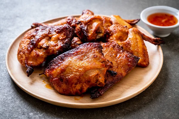 grilled and barbecue chicken on table