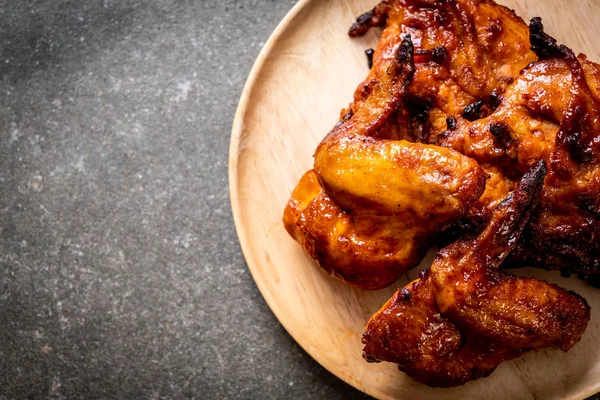 grilled and barbecue chicken on table