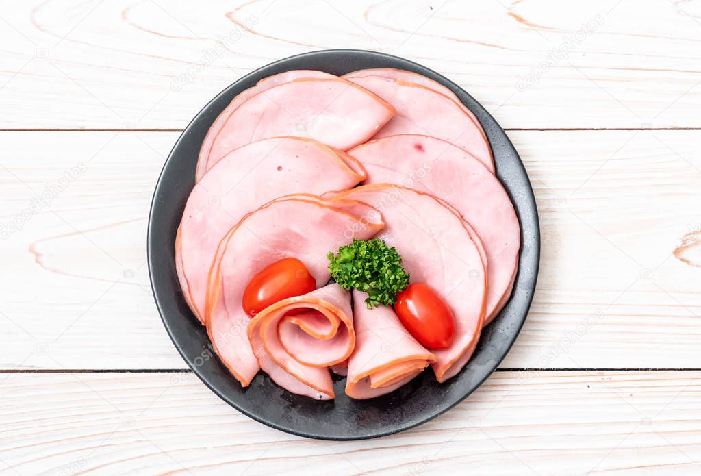 smoked ham sliced on plate