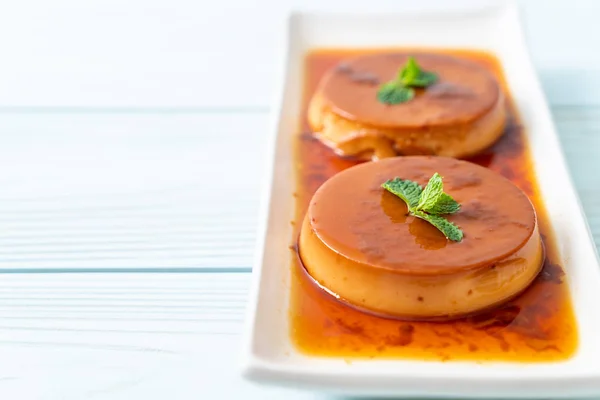 stock image homemade caramel custard pudding on wood background