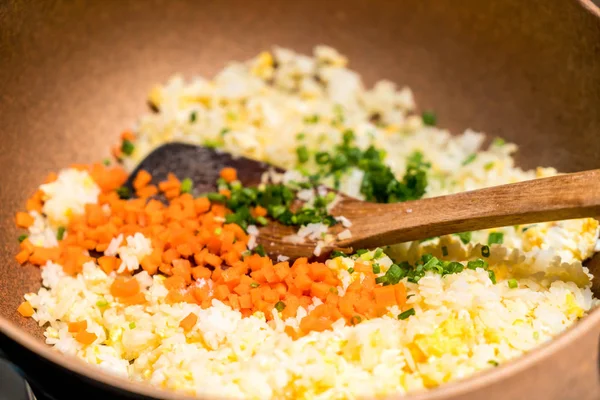 cooking fried rice on pan