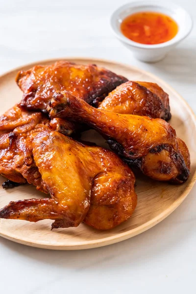 grilled and barbecue chicken on table