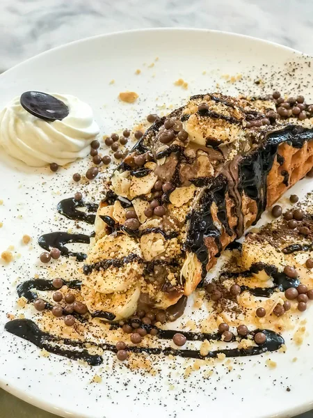 waffle with chocolate ice-cream and chocolate sauce