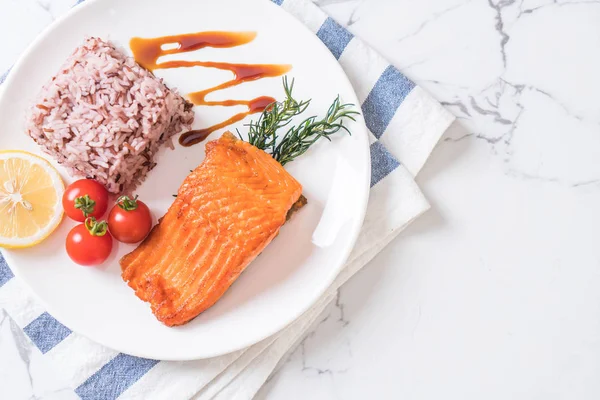 Salmon Steak with Berry Rice on plate