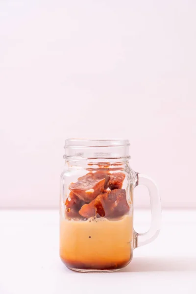 stock image Thai tea ice cube with milk on wood background