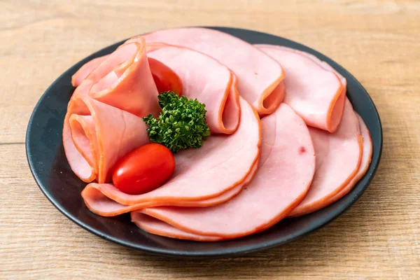 smoked ham sliced on plate