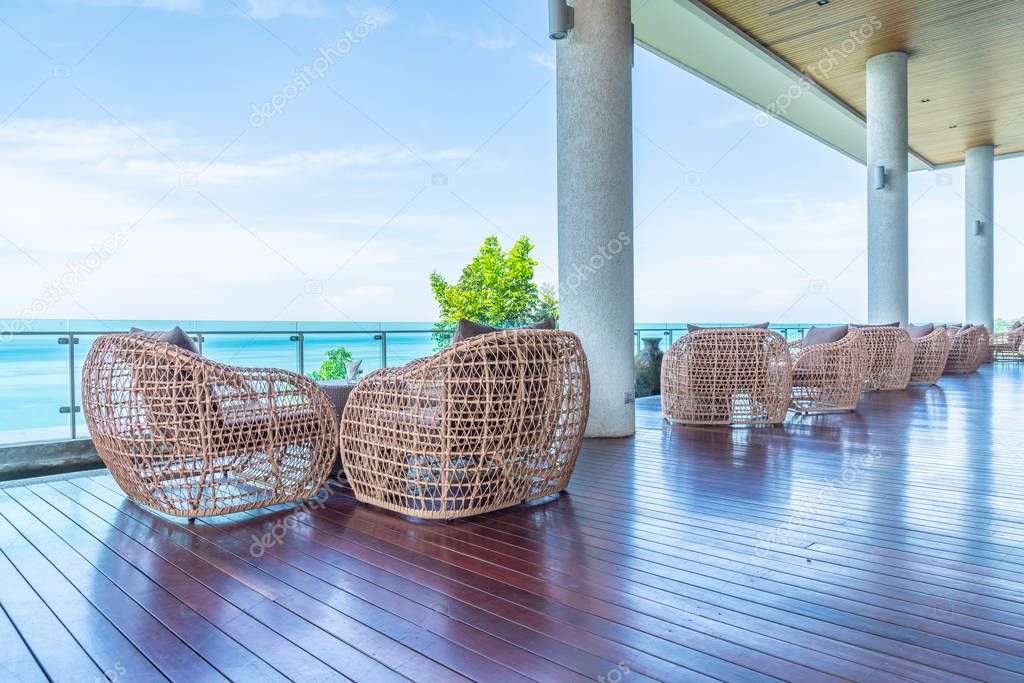 patio chair and table with sea view background