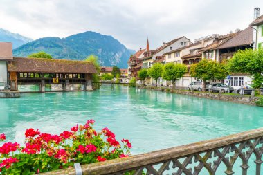 Interlaken town with Thunersee river in Switzerland clipart