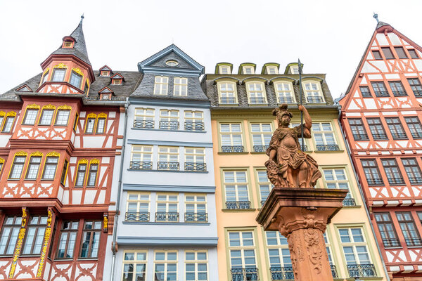 Beautiful old town square romerberg with Justitia statue in Frankfurt Germany