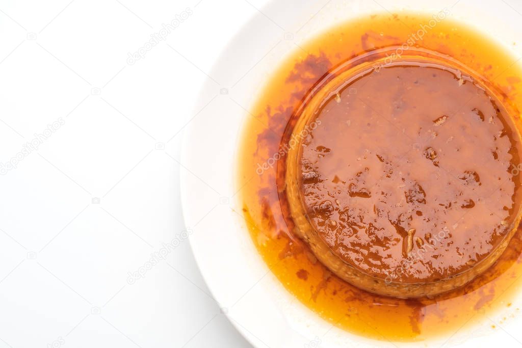 homemade caramel custard pudding isolated on white background