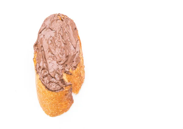 面包与巧克力榛子在白色背景上分散 — 图库照片