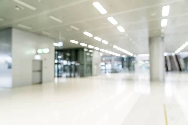 abstract blur and defocused in empty office building with glass window and copy space for background