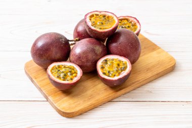 fresh passion fruit on wood board clipart