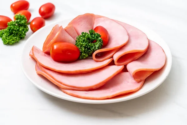 smoked ham sliced on plate