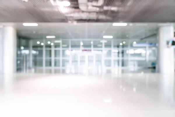 abstract blur and defocused in empty office building with glass window and copy space for background