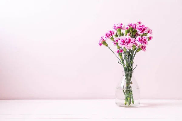 pink spring flower on wood background with copy space