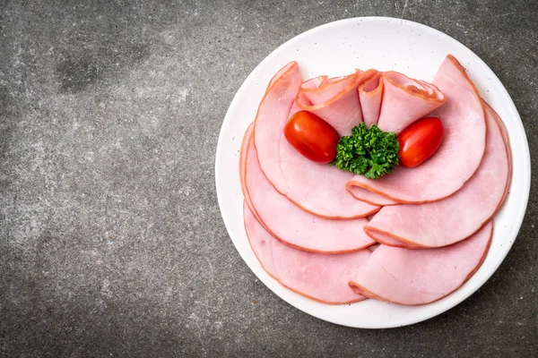 smoked ham sliced on plate