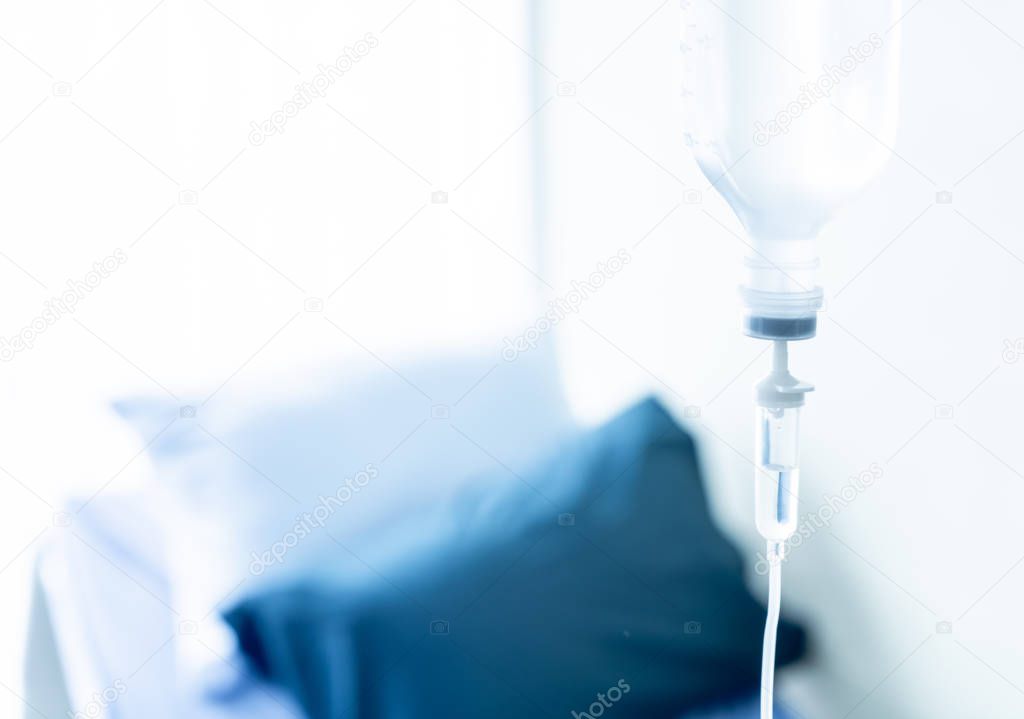 Saline solution drip for treatment patient with copyspace - blue white balance processing