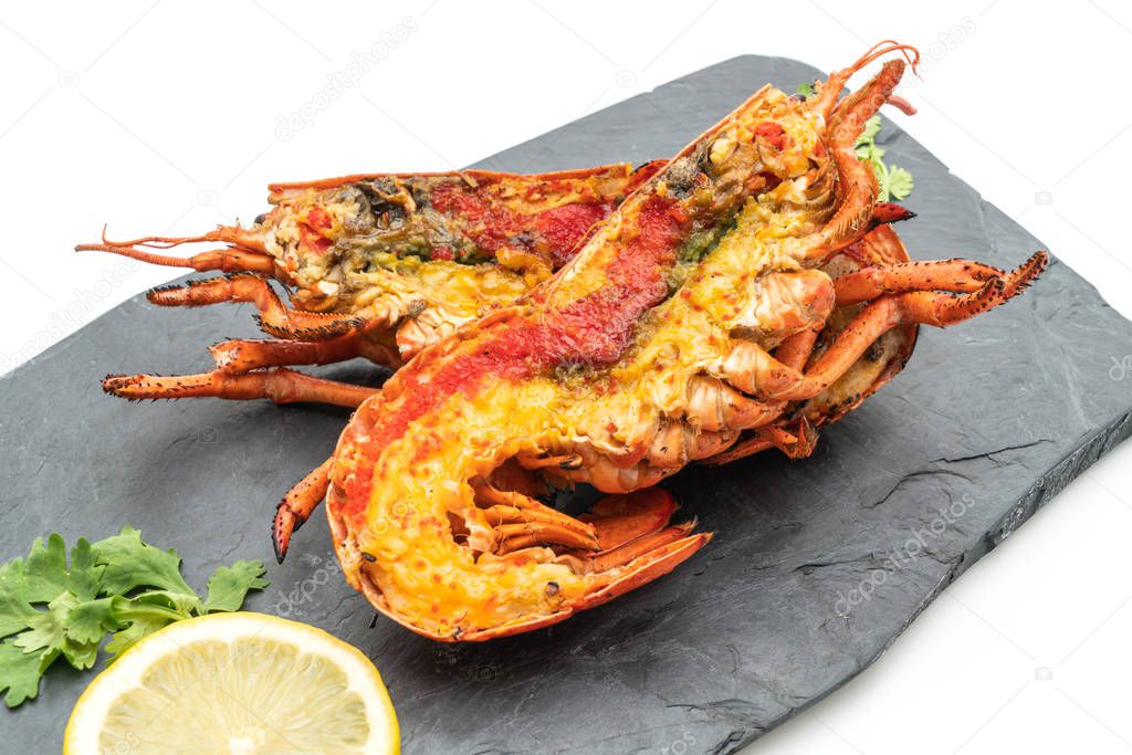 grilled lobster steak with lemon isolated on white background