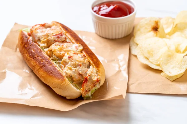 homemade lobster roll with potato chips