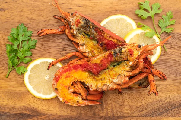 grilled lobster steak with lemon isolated on white background